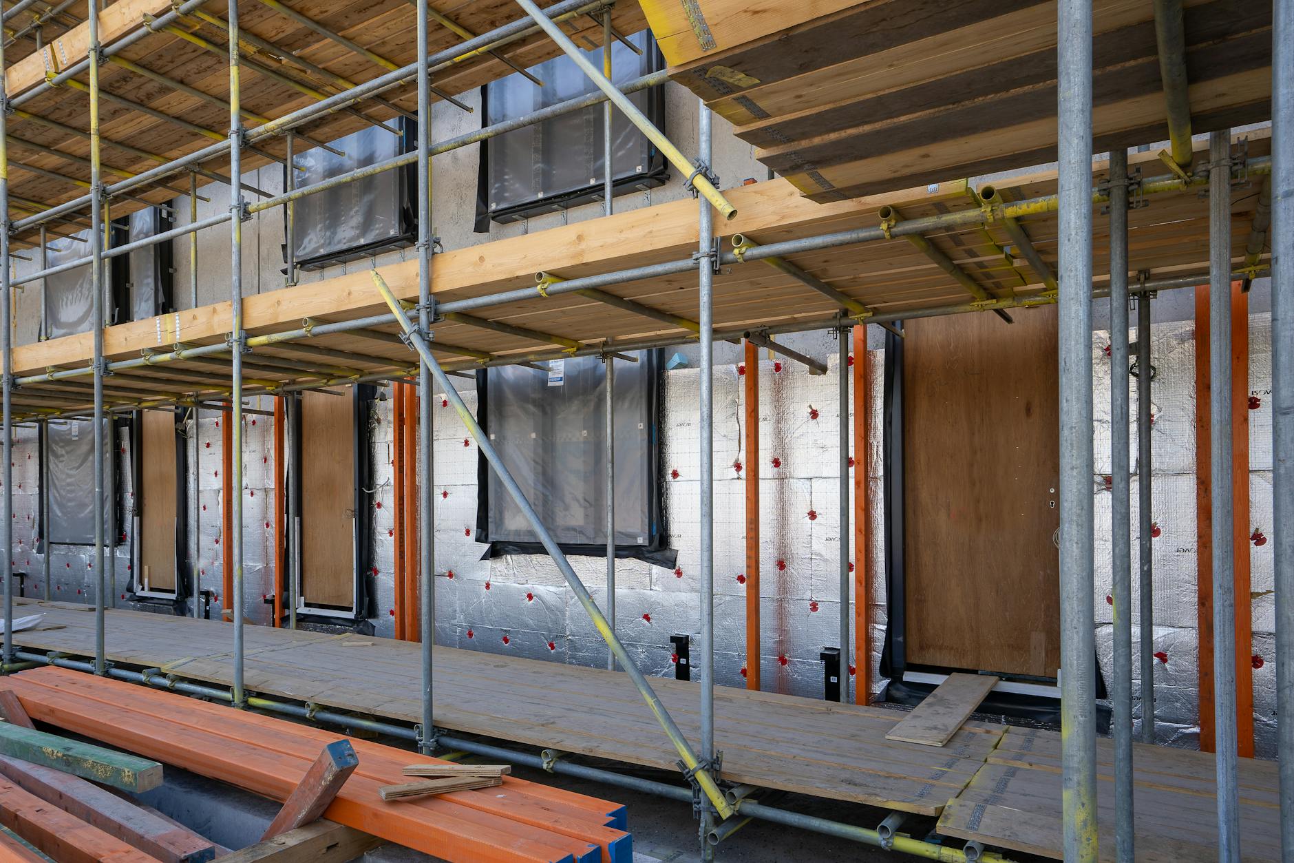 Spray foam insulation application on wall